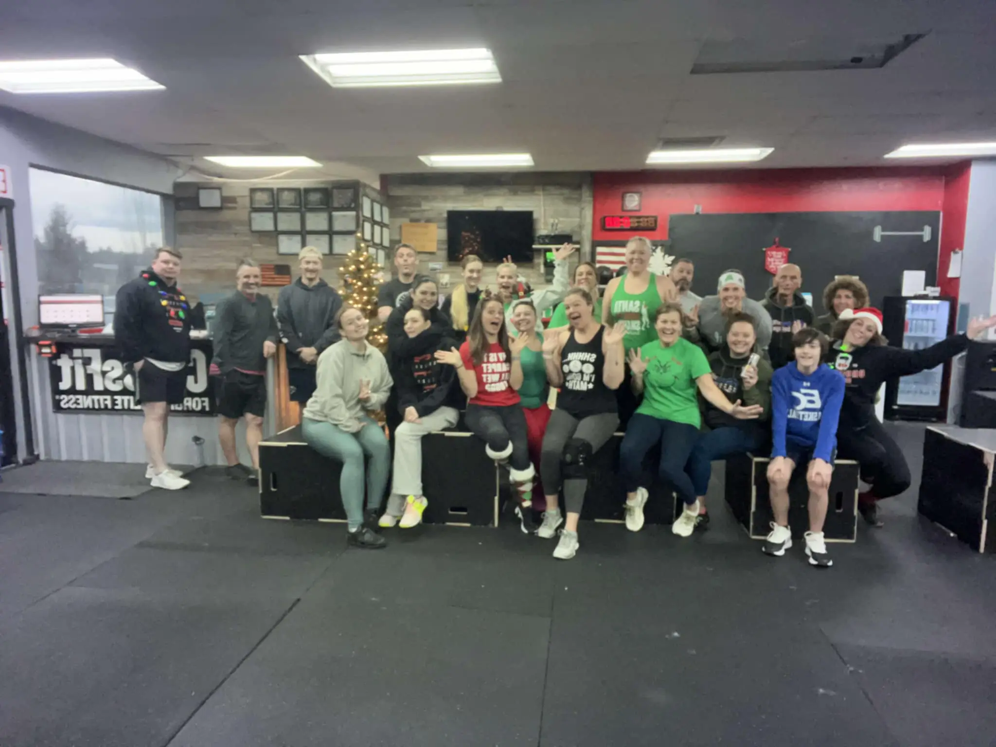 CrossFit Deluge community members working out together, celebrating achievements, and supporting each other in a motivating group fitness environment