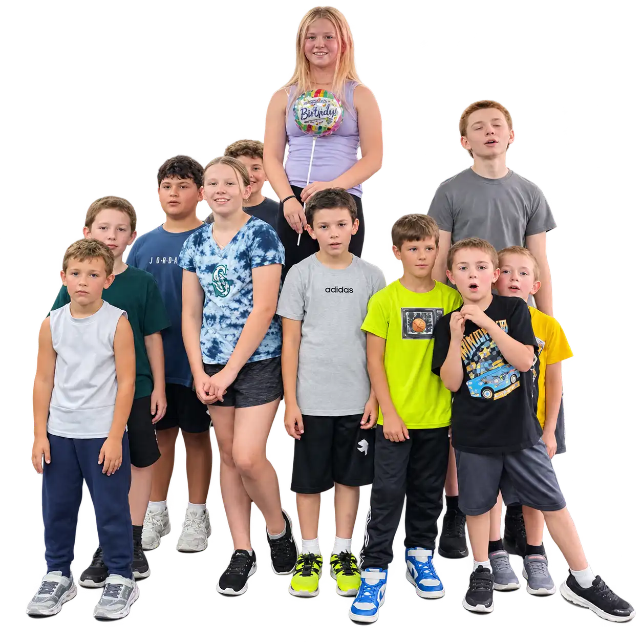 The CrossFit Kids class at CrossFit Deluge in Graham, WA — athletes from roughly five to fifteen years old standing together after class.