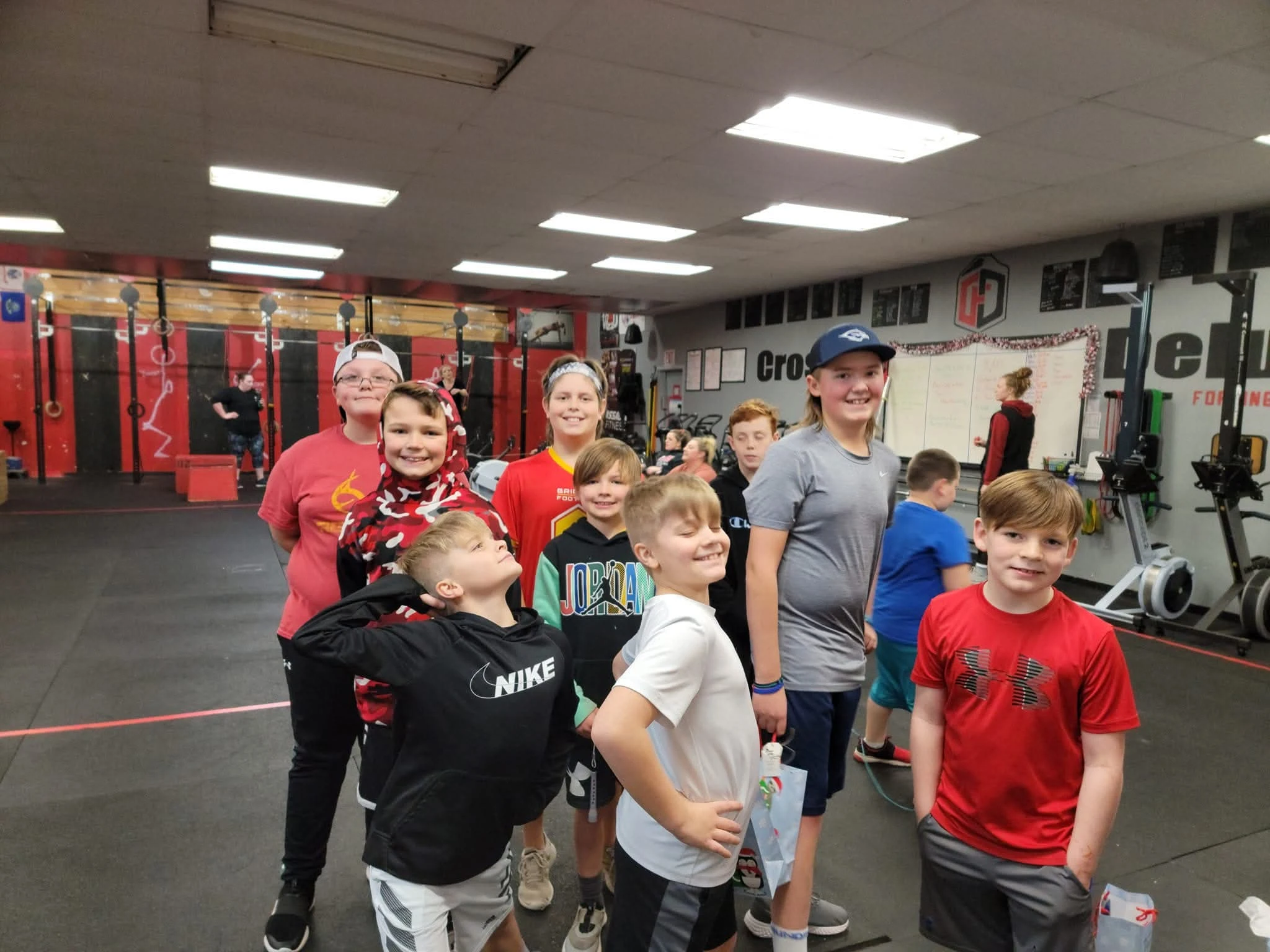 A group of CrossFit Kids athletes together after class at CrossFit Deluge.
